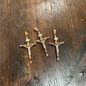 Three cross pendants